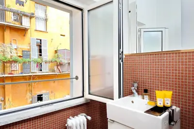 a bathroom with a sink and a window at Pantheon - Argentina Luxury in Rome