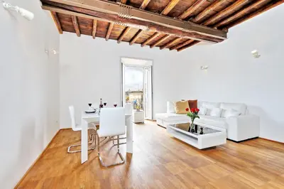 a living room with white furniture and a table at Pantheon - Argentina Luxury in Rome