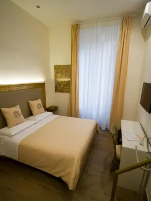 a bedroom with a large bed and a window at Art Atelier Accomodation Guest House in Rome