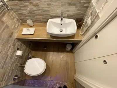 a bathroom with a sink and a toilet at Art Atelier Accomodation Guest House in Rome
