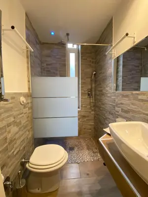 a bathroom with a toilet and a sink at Art Atelier Accomodation Guest House in Rome