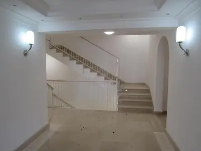 an empty hallway with stairs in a building at Pianeta Roma 45 in Rome