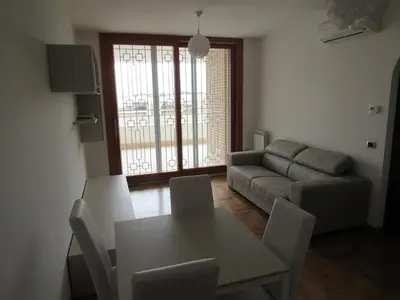 a living room with a table and a couch at Pianeta Roma 45 in Rome
