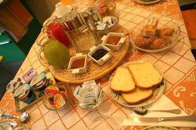 a table with a plate of sandwiches and other food at B&B Buongiornoroma in Rome