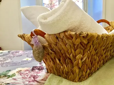 a basket with a hat on top of a table at Festina Lente in Rome