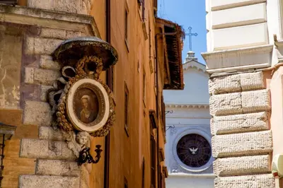 a picture of a statue on the side of a building at Palazzo Medusa in Rome