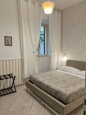 a bedroom with a bed and a window at Eufonia Vatican Days in Rome