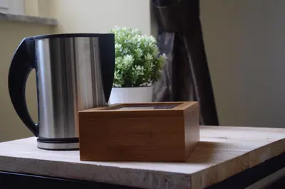 a coffee pot and a box on a table at Domus Corsini in Rome