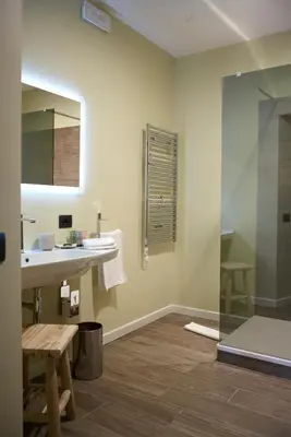 a bathroom with a sink and a mirror at Domus Corsini in Rome