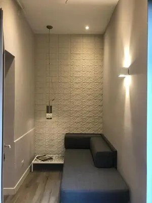 a room with a bench in the corner of a room at Rome Studio Rental in Rome