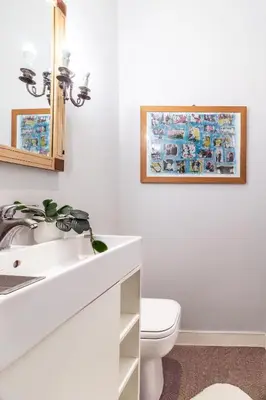 a bathroom with a white sink and a toilet at Monserrato Historical by Campo de' Fiori in Rome