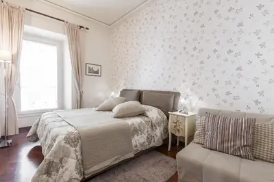 a bedroom with a bed and a couch at Rent Home In Rome in Rome