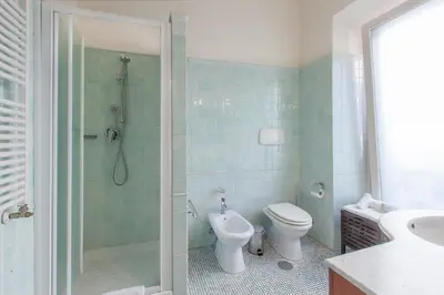 a bathroom with a shower and a toilet and a sink at Rent Home In Rome in Rome