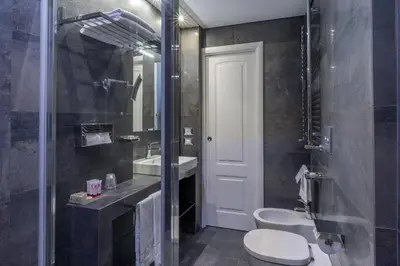 a bathroom with a toilet and a sink at Les Diamants in Rome