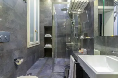a bathroom with a sink and a shower at Les Diamants in Rome