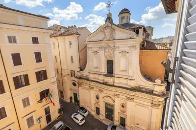 an overhead view of a building with a clock on it at Farnese Apartment 1870 in Rome