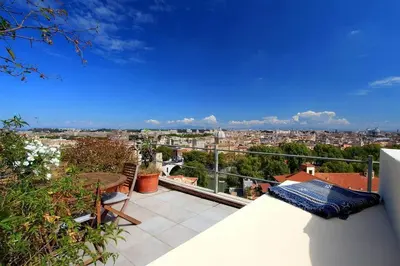 a balcony with a view of a city at Sant'Onofrio Terrace Apartment in Rome