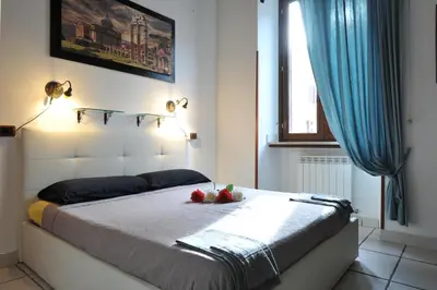 a bedroom with a bed with a bowl of fruit on it at Roma sogno infinito in Rome