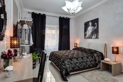 a bedroom with a bed and a desk and a window at Dreamsrome Suites in Rome