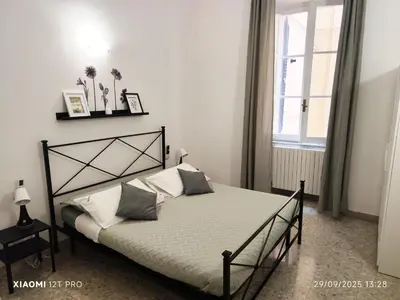 a bedroom with a bed and a window at Praetorian apartment in Rome