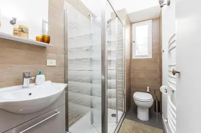 a bathroom with a sink and a toilet at The Sweet Terrace in Rome