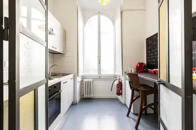 a small kitchen with a table and a window at The Sweet Terrace in Rome