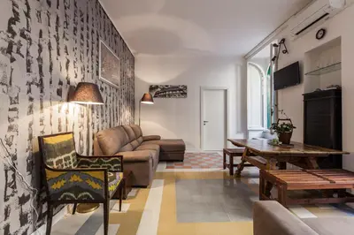 a living room with a couch and a table at The Sweet Terrace in Rome