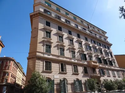 a building with a clock tower on top of it at The Sweet Terrace in Rome