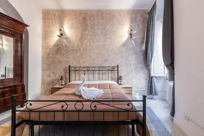 a bedroom with a bed with a swan on it at The Sweet Terrace in Rome