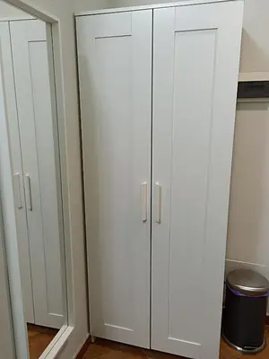 a pair of white cabinets in a room at Martini Rooms in Rome