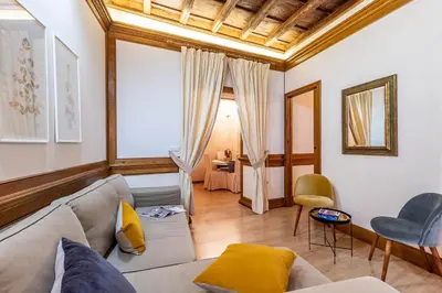 a living room with a couch and a table at Spagna Historical by Spanish Steps in Rome