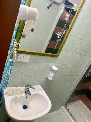 a bathroom with a sink and a mirror at Casa Fanti 57 in Rome