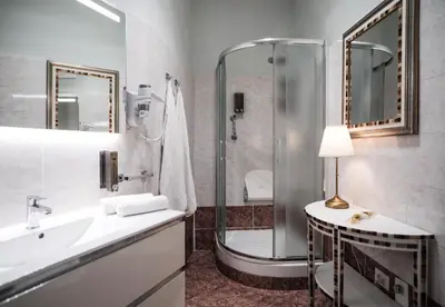 a bathroom with a shower and a sink and a tub at Roman Holidays House Marconi in Rome