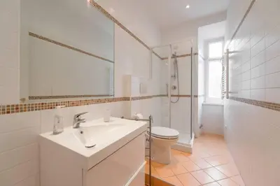 a bathroom with a sink and a toilet and a shower at EnzHouse in Rome