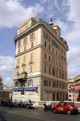 a large building with motorcycles parked in front of it at EnzHouse in Rome