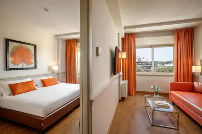 a hotel room with a bed and a couch at Grand Hotel Fleming by OMNIA hotels in Rome