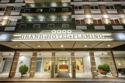 a hotel building with a sign that reads grand hotel filling at Grand Hotel Fleming by OMNIA hotels in Rome