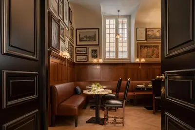 a room with a table and chairs and a window at Palazzo Ripetta in Rome