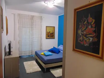 a small bedroom with a bed and a window at Studiohouserome in Rome