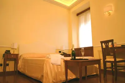 a bathroom with a glass shower and a sink at Luxury Ludovisi Rooms in Rome