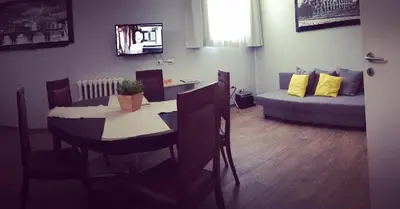 a living room with a table and a couch at Caracalla Room Rental in Rome