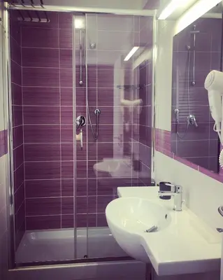a bathroom with a sink and a shower at Caracalla Room Rental in Rome