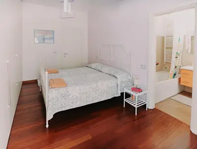 a bedroom with a bed and a bath tub at Casanova in Rome