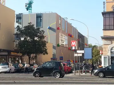 a city street with cars parked on the street at Casanova in Rome