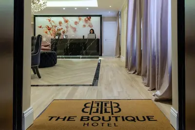 a door with a sign that reads she the boutique hotel at The Boutique Hotel in Rome