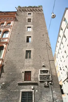 a tall brick building with windows in a city at Residenza Torre Colonna in Rome