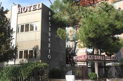 a building with a sign for a hotel at Hotel Desiderio in Rome