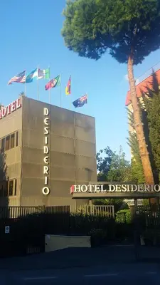 a hotel sign with flags on top of a building at Hotel Desiderio in Rome