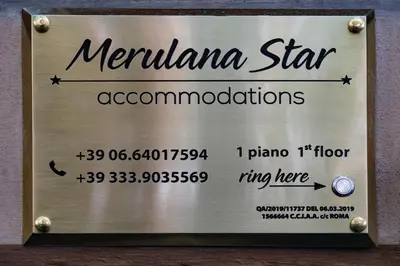 a sign for a merkala star accomodations at Merulana Star in Rome