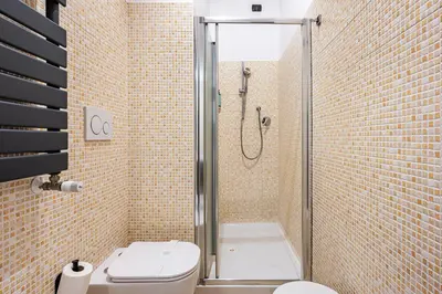 a bathroom with a shower with a toilet and a sink at Cola Di Rienzo Suite Guest House in Rome